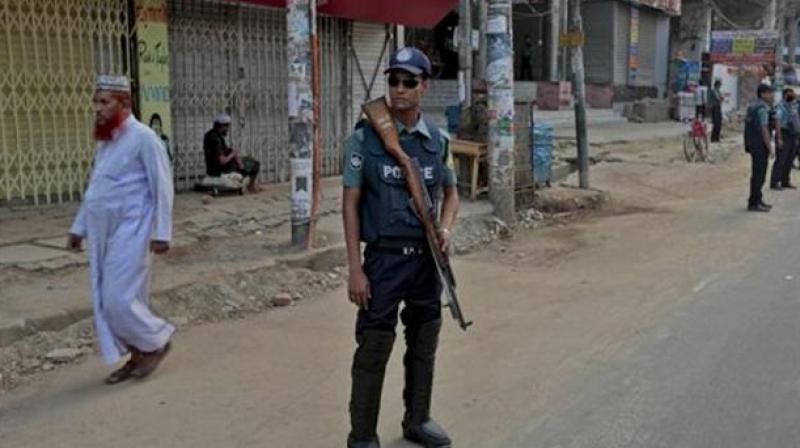 A file photo shows policemen standing guard on a road in Dhaka. (Photo: AP/ Representational Image)