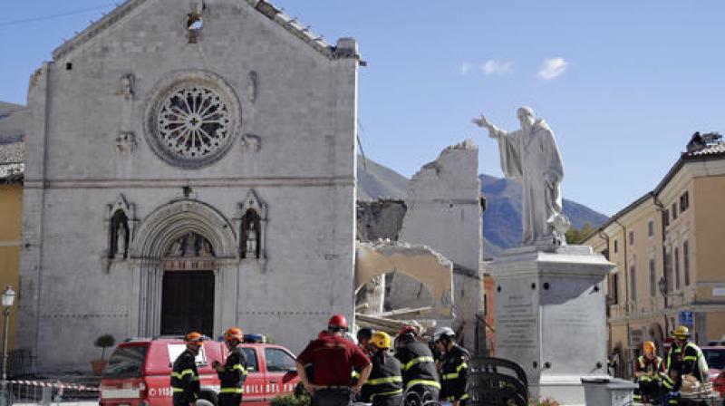 talian Firefighters gather near the collapsed Benedictine Cathedral of Norcia, central Italy. (Photo: AP)