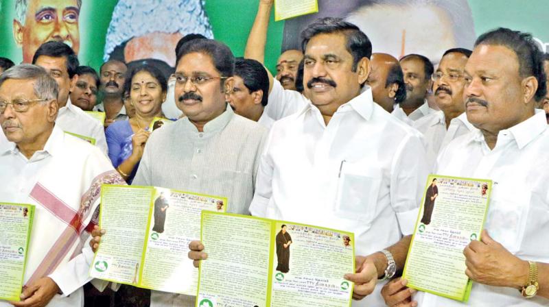 AIADMK (Amma) party candidate T.T.V Dinakaran and Chief Minister Edappadi K. Palanisami release the election manifesto for the R.K. Nagar constituency at the party headquarters on Monday. (Photo: DC)