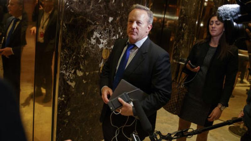 Sean Spicer arrives at Trump Tower in New York. The Obama administration is aware of frequent contacts between President-elect Donald Trumps top national security adviser Michael Flynn and Russias ambassador to the U.S., including on the day President Barack Obama hit Moscow with sanctions in retaliation for election-related hacking. (Photo: AP)
