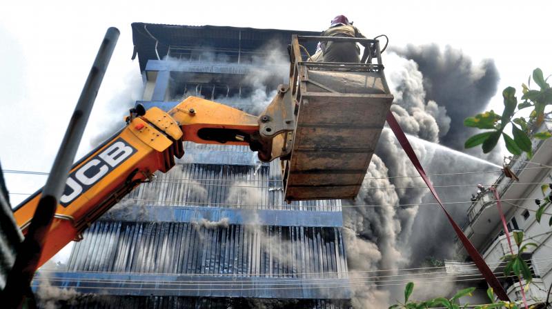 Fire breaks out at the six-storeyed building of Paragon footwear godown cum office in Kochi on Wednesday.   (SUNOJ NINAN MATHEW)