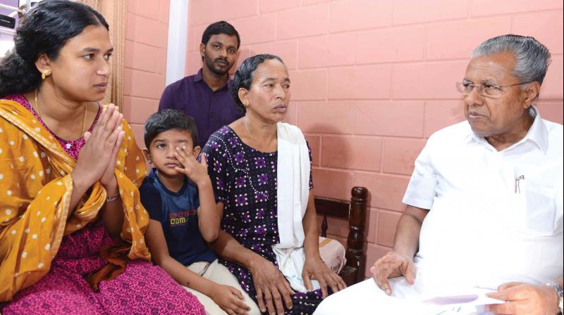 Chief minister Pinarayi Vijayan visits relatives of  slain soldier V.V. Vasanthakumar at Thrikkaipatta near Kalpetta, Wayanad, on Wednesday.