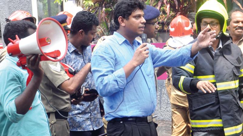 Ernakulam district collector Mohammad Y. Safirulla oversees rescue operation at the fire accident spot. (DC)