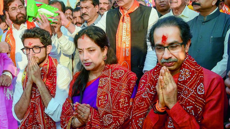 Shiv Sena chief Uddhav Thackeray, Yuva Sena chief Aditya Thackeray and Rashmi Thackeray offer prayers at Laxman Qila ahead of the Ram Temple event to be held tomorrow, in Ayodhya, Saturday. (PTI)