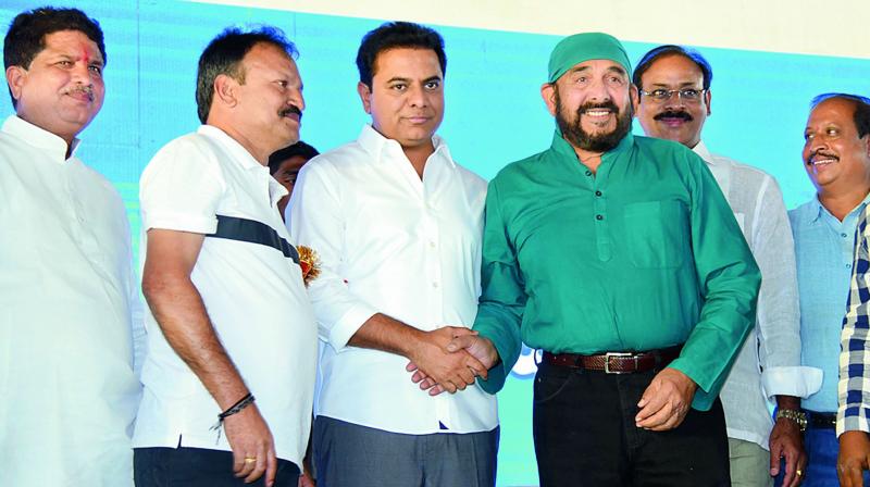 TRS leader and caretaker minister K.T. Rama Rao greets actor Vijay Chander during Seemandrula Sangibhavam Sabha organised at Kukatpally on Saturday.  (P. Pawan)