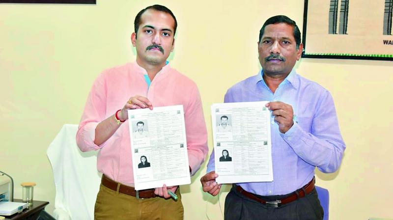 District collector and election officer Prashanth J. Patil and Joint collector S. Dayanand releasing the voter slips on Saturday. 	(DC)