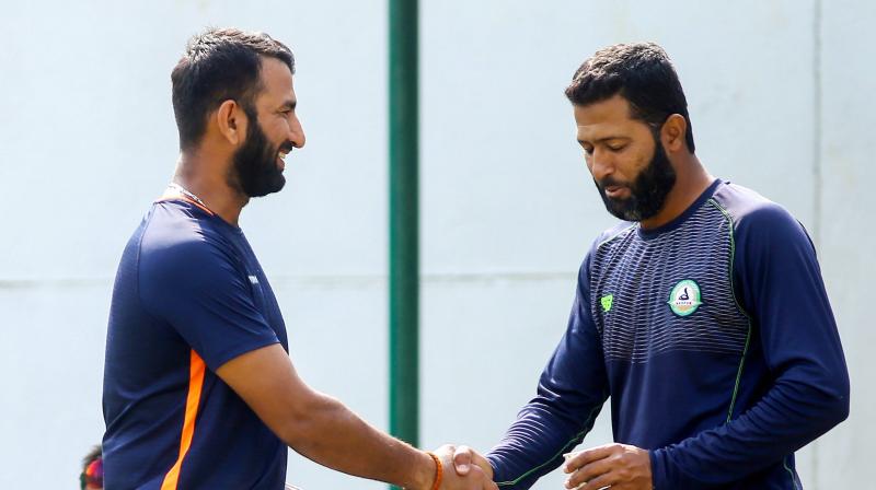 The battle lines are drawn and the summit clash will not just be about Pujara and Umesh only but also about Wasim Jaffer, who is a domestic doyen in every sense of the terms. (Photo: PTI)