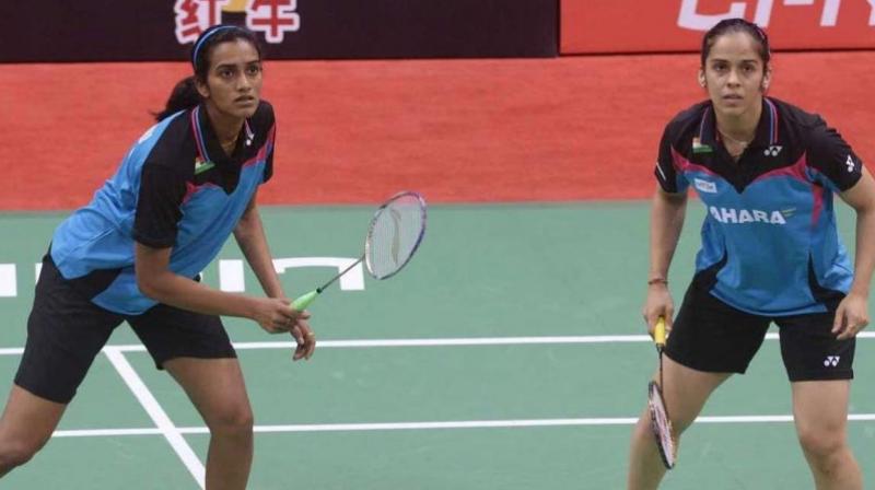 Both Saina Nehwal and PV Sindhu are clubbed in the 2 halves and could set up a mouth-watering final clash on Sunday. (Photo: AFP)