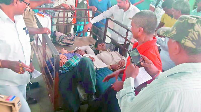 The drugged passengers on the platform at the Khazipet rail station on Tuesday. They were taken to the MGM Hospital in Warangal. (Photo: DC)