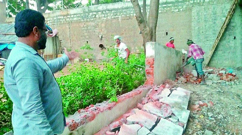 Andhra Pradesh DGP R.P. Thakur got the compound wall of his house demolished.