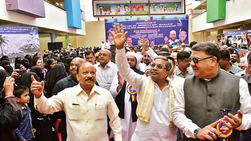 CM Siddaramaiah with ministers R. Roshan Baig and Tanveer Sait at the inauguration of the Government VKO School and VKO PU College at Shivajinagar in Bengaluru on Saturday (Photo: DC)