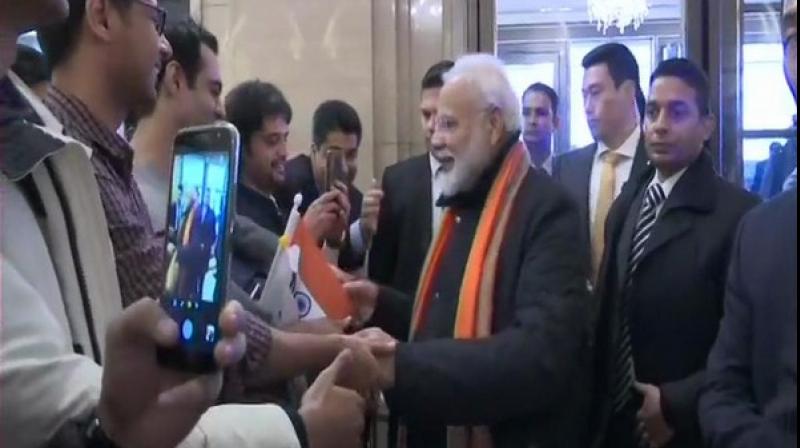 Upon the Prime Ministers arrival in Seoul Indians who were waiting for him in the hotel lobby, waived the tricolor and took selfies with him. (Photo: ANI)
