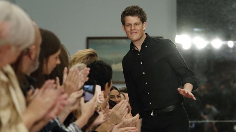 Creative Director Wes Gordon acknowledges audience applause after the Carolina Herrera spring 2019 collection was modeled during Fashion Week in New York, Monday, Sept. 10, 2018.(Photo: AP)