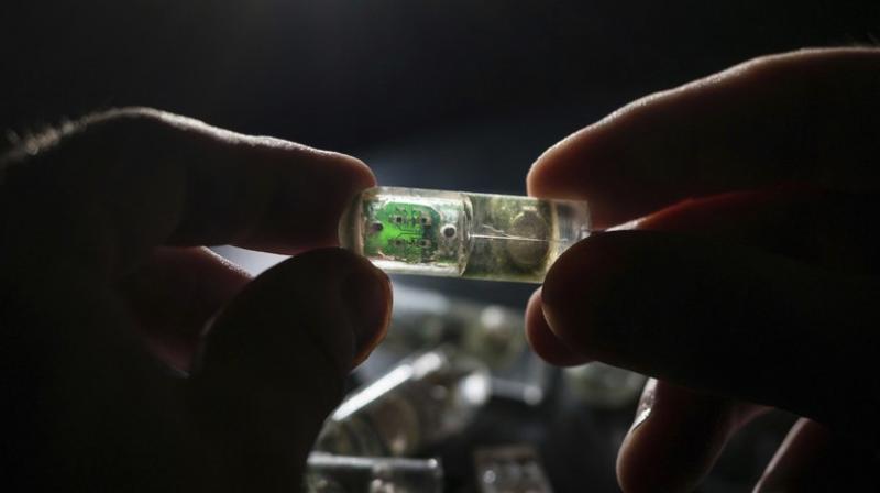 Pills equipped with cameras, thermometers and acidity gauges already look for disease and track digestion (Photo: AP)