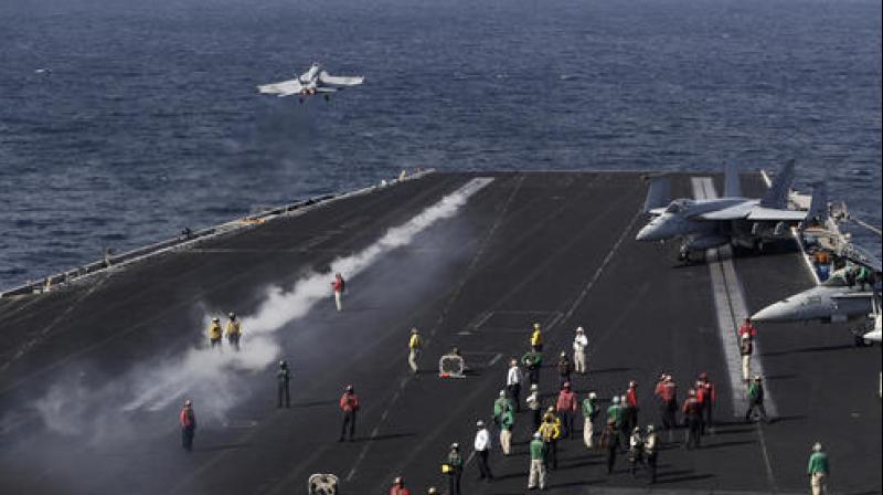 The sorties from the Eisenhower have dropped nearly 1,100 bombs on IS targets since June when the ship entered the Persian Gulf after launching strikes from the eastern Mediterranean. (Photo: AP)