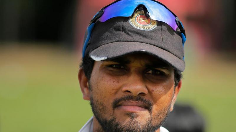 Sri Lanka skipper Dinesh Chandimal was slapped with two suspension points and fined 100 per cent of his match fee for the offence in the wake of ball-tampering row. The points equate to a ban from one Test or two ODIs or two T20s. (Photo: AP)
