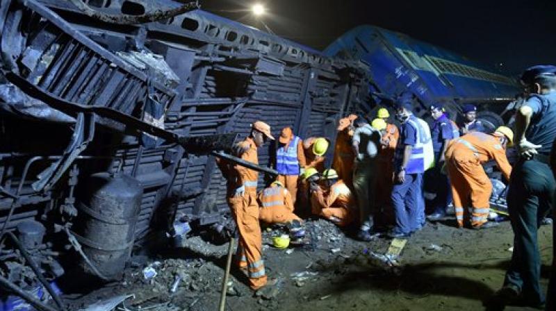 The NDRF rescue team at the mangled coaches of the Puri-Haridwar Utkal Express train after it derailed in Khatauli near Muzaffarnagar on Saturday. (Photo: PTI)