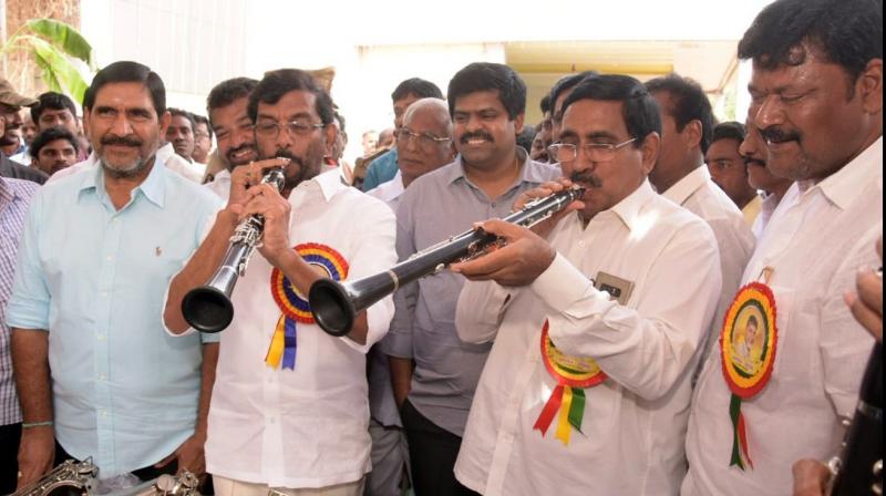 Ministers Somireddy Chandramohan Reddy and  P. Narayana play musical instruments at a programme held to distribute tools in Nellore on Monday (Photo; DC)