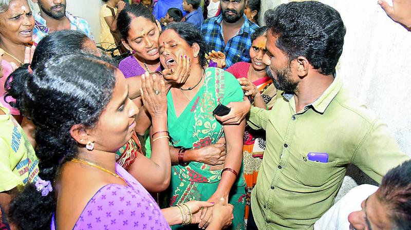 Well-wishers try to console the mother of a drowning victim in Visakhapatnam on Sunday (Photo: DC)