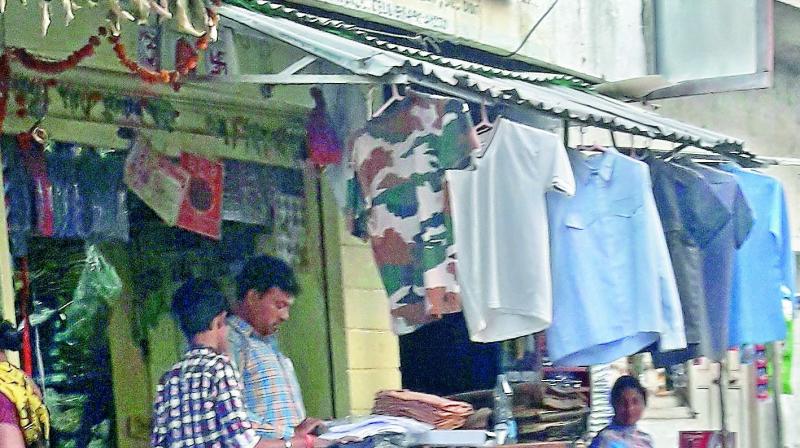 Shopkeepers selling police uniform do a brisk business in Hyderabad due to large-scale promotions of police officials. (Photo: DC)