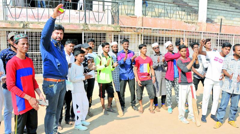 Children cheer madrasa students who participated in the two-day cricket match organised for the first time by a social organisation in the Old City on Thursday.