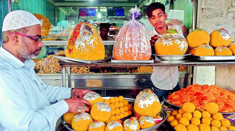 Sayeed Bin Mohammed Bahbela of Huma sweets in Chandrayangutta selling big laddus during Ganesh celebrations.   (Photo:DC)