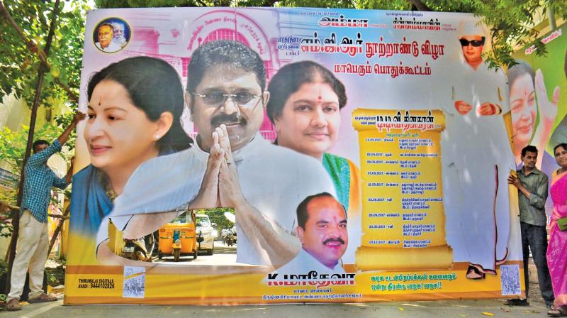 A banner of TTV with pictures of Sasikala and Jaya lies torn near his Besant Nagar residence on Saturday. (Photo:DC)