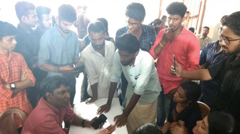 Students protest at the Kerala University Youth Festival venue at Kollam on Saturday alleging move to sabotage the results.