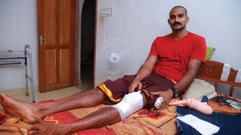 Tripple jumber athlete Renjith Maheswari recovers at his home following an injury at Channanikadu near Chingavanam in Kottayam on Thursday	(Photo: DC)
