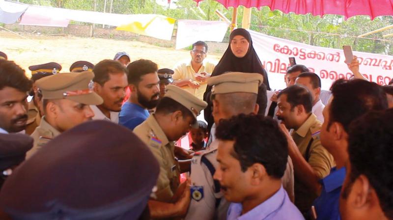 Police arrests Shibina Churapulakkal from the protest venue at Swagathamadu near Kottakkal on Tuesday.