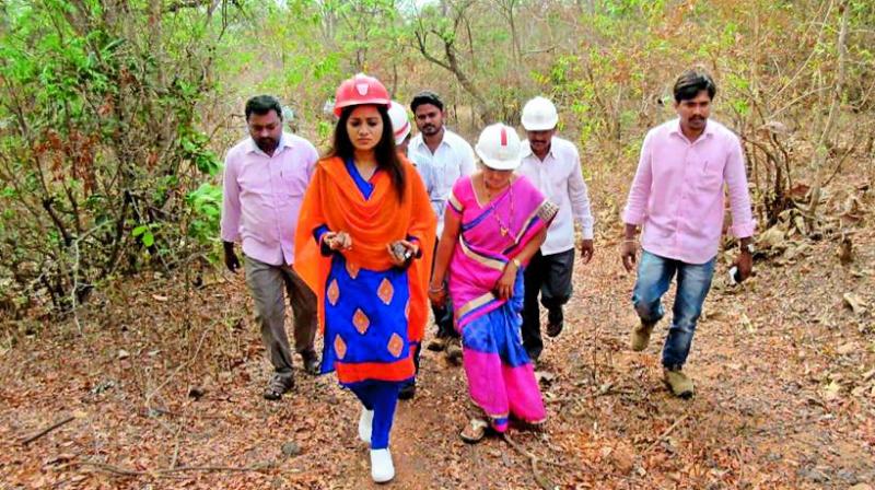 Reshma Rathore inspects the iron ore in Bayyaram forest area.