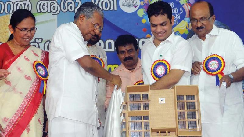 Chief minister Pinarayi Vijayan releases the model of super specialty block proposed at Ernakulam government general hospital in Kochi on Thursday. Hibi Eden, MLA and K.V. Thomas, MP, are also seen.