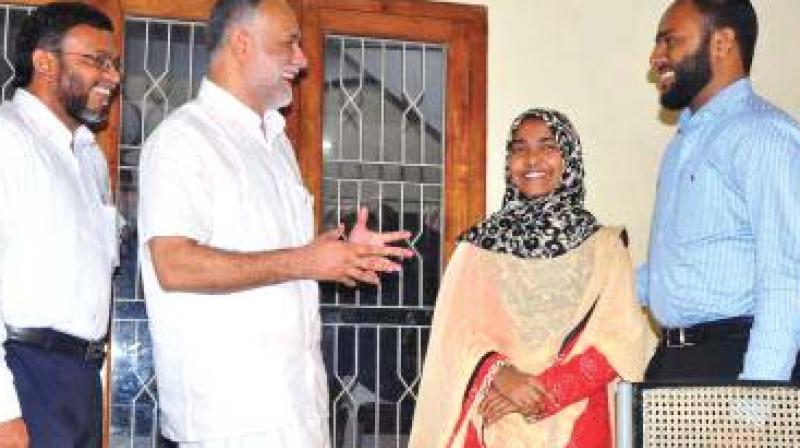 Hadiya and husband Shefin Jehan meet Popular Front of Indias national chairman P. Abubacker.  	 DC FILE