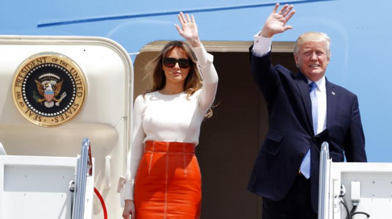 Donald Trump, Melania Trump  President Donald Trump and first lady Melania Trump, wave as they board Air Force One at Andrews Air Force Base, prior to his departure on his first overseas trip. (Photo: AP)