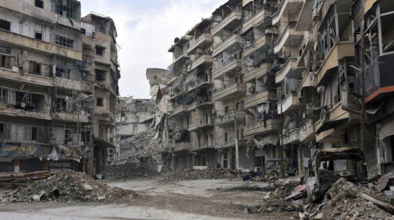 Syrian rebels outside Aleppo on Friday shelled a neighborhood in the northern city, killing three people in the first bombardment since government forces took control of the whole city after opposition fighters in the eastern parts withdrew. (Photo: AP)