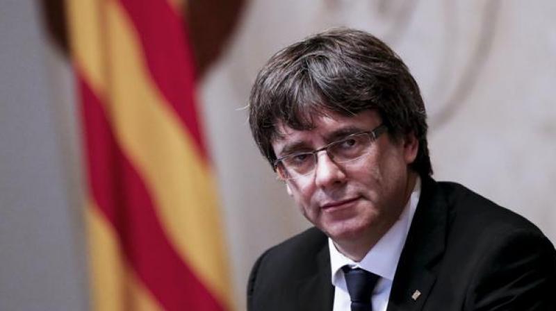 Catalan president Carles Puigdemont and four ex-regional ministers presented themselves to federal police at around 9 am. (Photo: AFP)