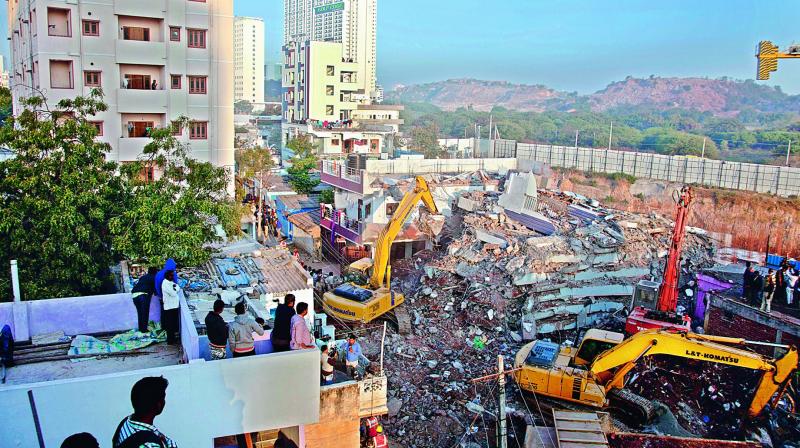 Salvage teams work on Friday to remove the debris of the under-construction building that came down in layers at Nanakaramguda on Thursday. (Photo: AFP)