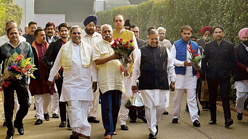 Chief Minister Siddaramaiah, and Congress MPs Prakash B. Hukkeri and Rehaman Khan on their way to wish AICC president Sonia Gandhi on her birthday in New Delhi on Friday. (Photo: PTI)
