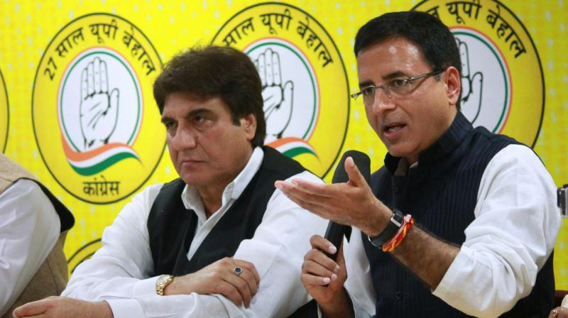 UP Congress President Raj Babbar with party spokesperson Randeep Singh Surjewala addressing a press conference at the party headquarters in Lucknow. (Photo: PTI)
