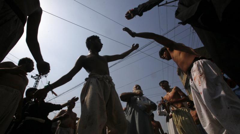 In Photos: Test of faith as devotees mark Ashoura in Pakistan
