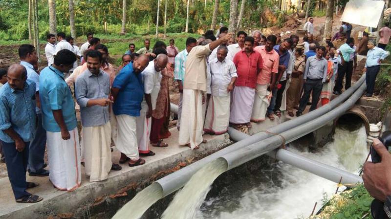Ministers and officials  monitoring pumping of water from Kappukadu on the banks of Neyyar on Thursday.