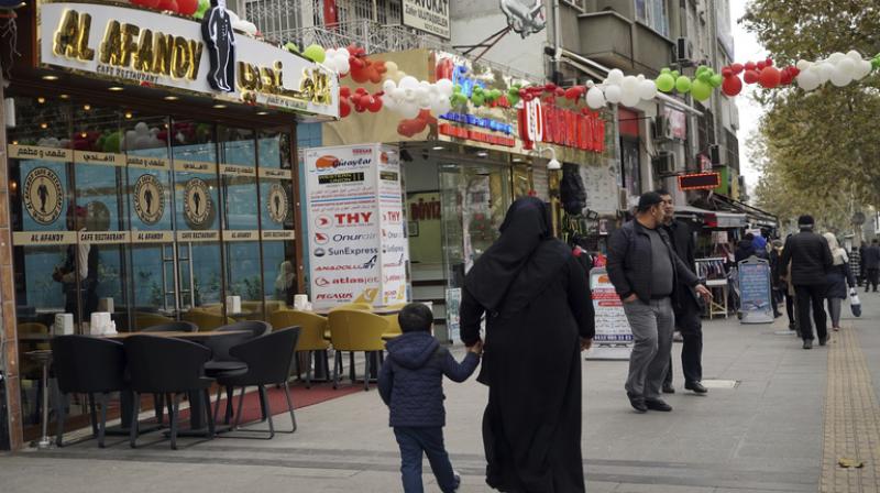 People walk in the Fatih district in Istanbul. (Photo: AP)