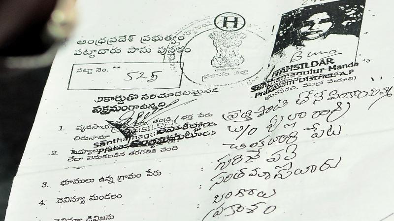 The documents in the name of Prathipati Tene Venkayamma wife of Minister Pulla Rao shown by YSRC legislator Chevireddy Bhaskar Reddy. (Photo: DC)