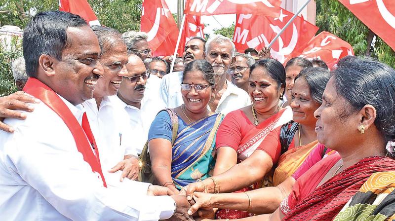 CPI (M) party women cadres greet RK Nagar  bypoll candidate R. Loganathan. Party state  secretary G. Ramakrishnan also seen.(Photo: DC)