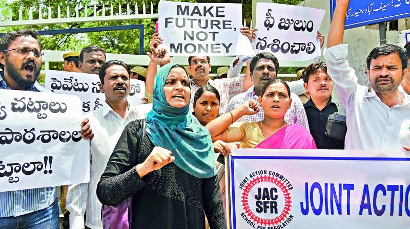 A file photograph of parents protesting against schools hiking fees. The parents had in the past sent 2,000 post cards to Chief Minister K. Chandrasekhar Rao on the  issue,  but are yet to hear from him. Fee hike affects the lives of parents and children across the state. (Photo: DC)