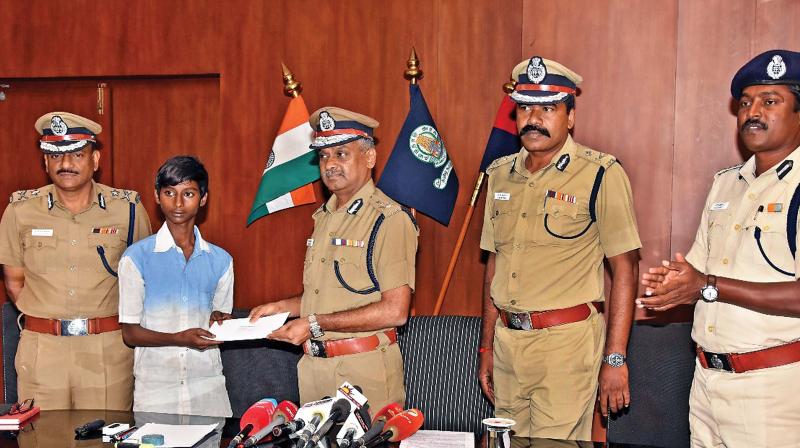 City police commissioner A.K. Viswanathan handing over certificate of appreciation to Suryakumar on Thursday. (Photo: DC)