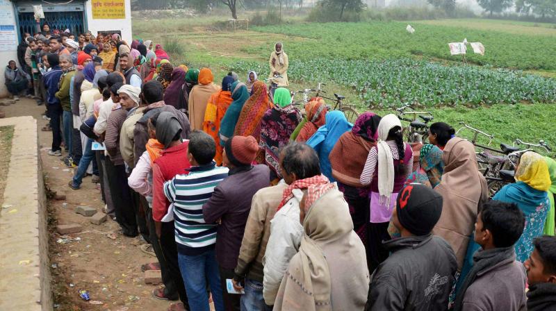 FIle photo of villagers queuing up in front of a bank branch to withdraw cash in Mirzapur recently. (Photo: PTI)