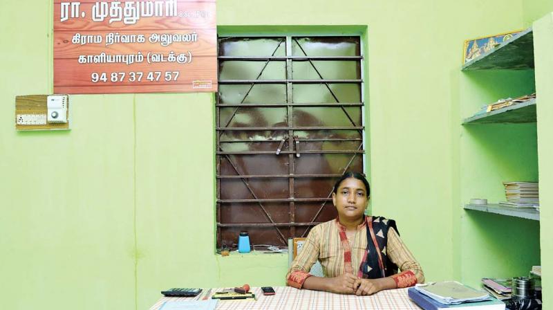 R. Muthumari, a Village Administrative Officer (VAO) from Kaliyapuram-North in Pollachi has put up a board in office vowing not to take bribe (Photo: DC)