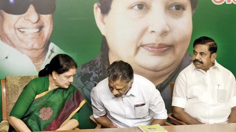 AIADMK Legislature party leader, V. K. Sasikala having a word with outgoing Chief Minister, O Paneerselvam on Sunday.  PWD Minister, Edappadi K Palanisamy is also seen. (Photo: DC)