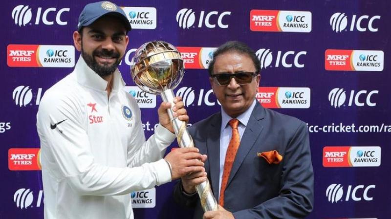 Virat Kohli received the mace and cheque from Sunil Gavaskar at a ceremony after the fourth and final Test against Australia. (Photo: BCCI)